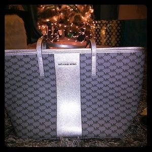 Authentic  Michael Kors purse and clutches/;tags